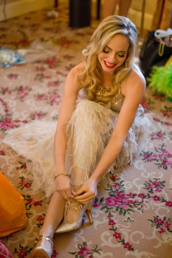 Grace putting her shoes on to go and get the groom down the hall :) 